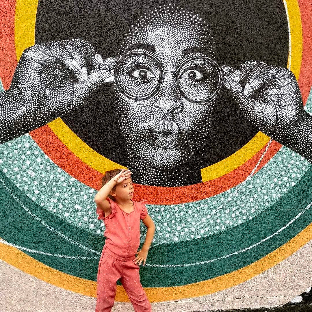 Maëlia participe au concours pour gagner de l'argent avec cette photo : art, beard, circle, cool, eyewear, fashion_accessory, fun, gesture, glasses, graphics, happy, headwear, illustration, moustache, pattern, people_in_nature, person, sleeve, smile, toddler