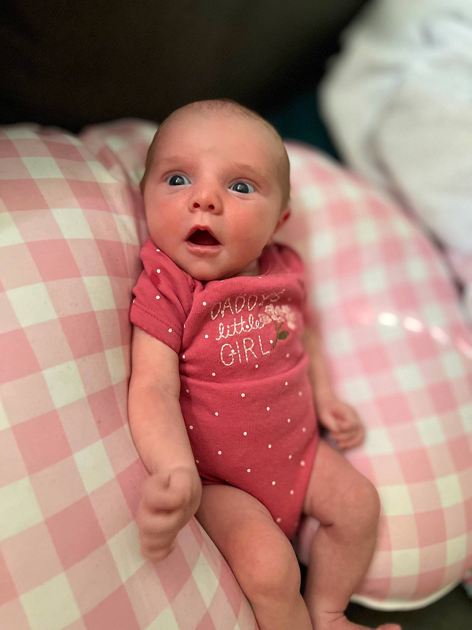 Braylee joined the competition — help win amazing prizes! baby, baby_toddler_clothing, cheek, chin, comfort, dress, finger, iris, leg, lip, mouth, nose, person, pink, skin, sleeve, stomach, surprise, tartan, thigh