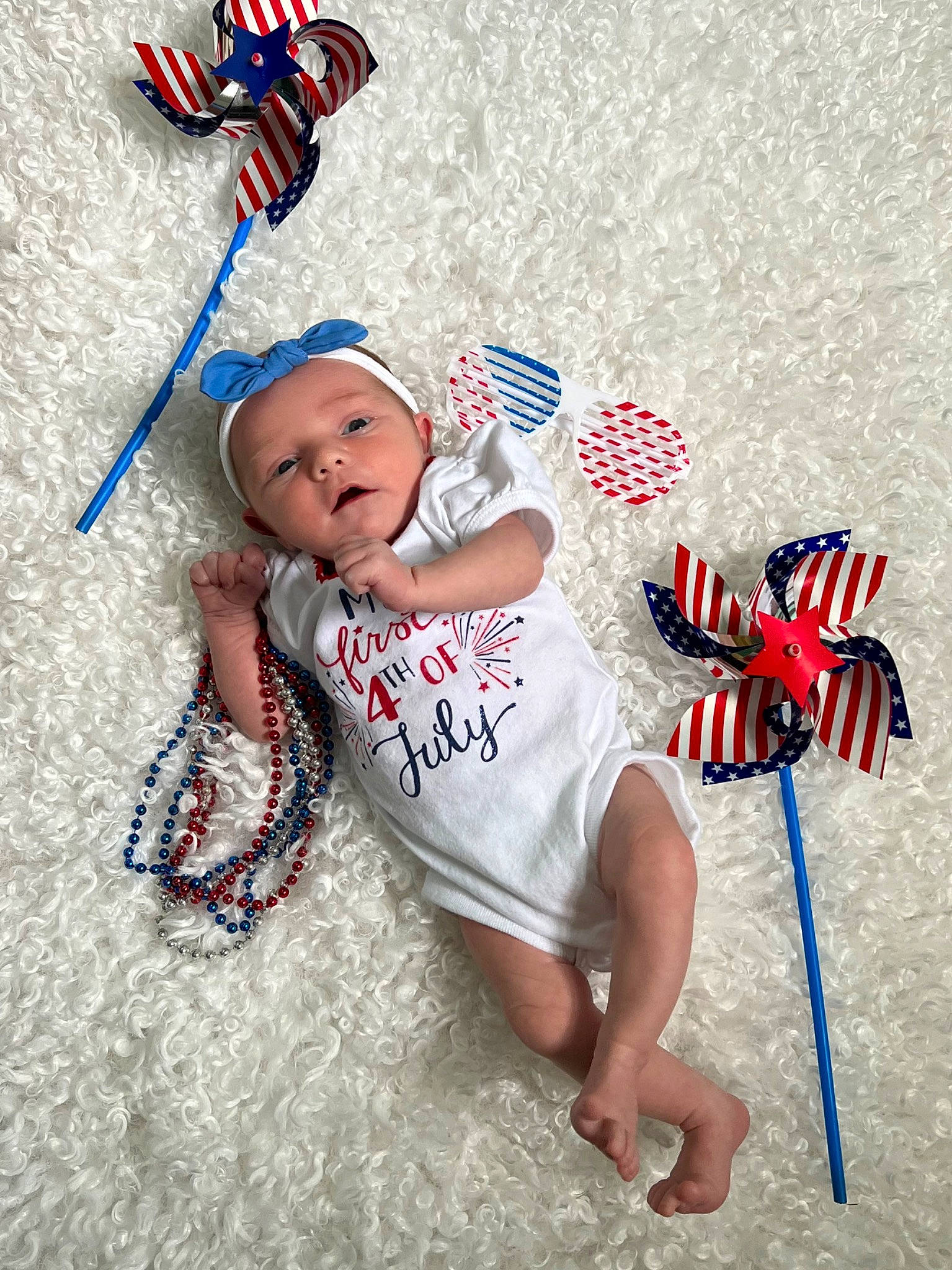 Braylee joined the competition — help win amazing prizes! baby, baby_toddler_clothing, carmine, child, costume_hat, electric_blue, event, fashion_accessory, flag, font, fun, gesture, happy, headgear, headwear, party_supply, pattern, person, red, sand