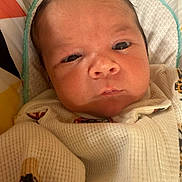 Isaiah is registered to the contest to win money with this photo: baby, newborn, infant, closeup, face, eyes, clothing, blanket, pattern, cute, soft, skin, portrait, child, sleeping, cozy, young, head, expression, indoors