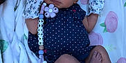 Amylah joined the competition — help win amazing prizes! baby, newborn, sleeping, headband, mittens, polka_dot, pacifier, blanket, floral, crib, mattress, infant, cute, peaceful, clothing, lying_down, indoors, accessory, child, nap