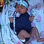 baby, newborn, sleeping, headband, mittens, polka_dot, pacifier, blanket, floral, crib, mattress, infant, cute, peaceful, clothing, lying_down, indoors, accessory, child, nap