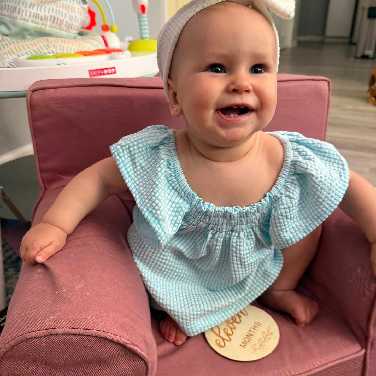 Emerson is registered to the contest to win money with this photo: architecture, armchair, baby, building, chair, clothing, couch, face, furniture, happy, hat, head, homedecor, indoors, livingroom, person, photography, portrait, room, sitting