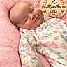 Stella joined the competition — help win amazing prizes! baby, infant, sleeping, onesie, floral_pattern, butterfly_pattern, pink_blanket, wooden_sign, hearts, flowers, cute, milestone, newborn, portrait, soft_texture, child, smiling, peaceful, closeup, indoor