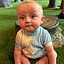 Heston joined the competition — help win amazing prizes! baby, infant, child, sitting, grass, artificial_grass, sweater, bunny, cute, indoors, wooden_stump, floor, footwearless, expression, curious, plush, hand, face, eyes, person