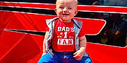Heston joined the competition — help win amazing prizes! baby, child, red_shirt, jeans, socks, smiling, outdoor, sunny, blue_sky, clouds, red_surface, casual_clothing, happy, portrait, sitting, cute, young_child, daylight, face, person