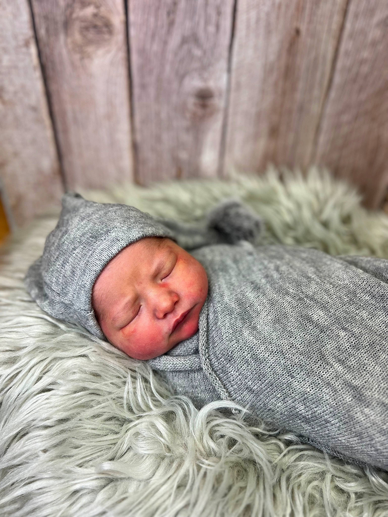 Kingston is registered to the contest to win money with this photo: baby, bedtime, child, comfort, eye, fur, grass, headgear, headwear, linens, nap, person, plant, portrait_photography, sitting, sleep, sorrow, toddler, tree, winter