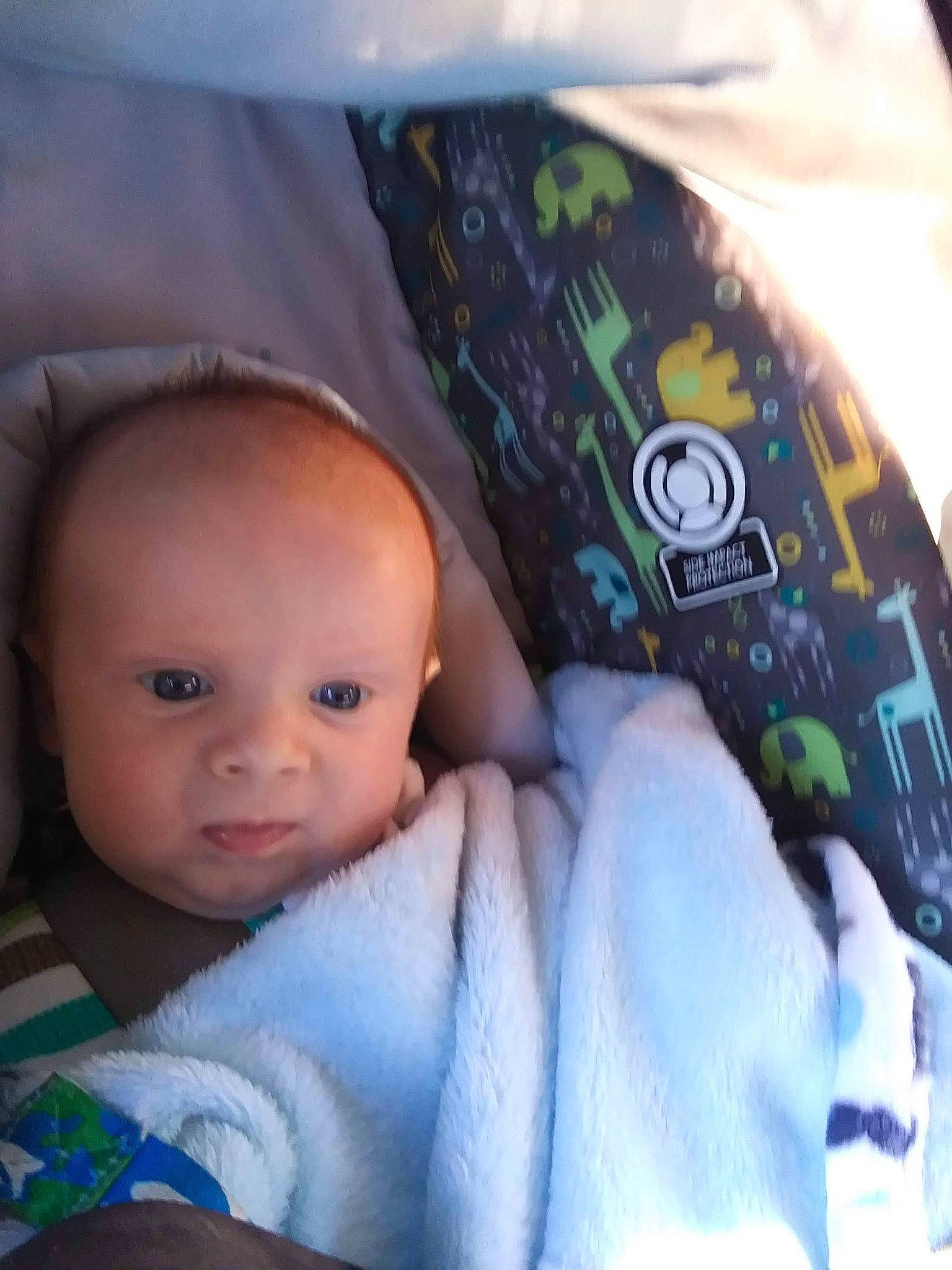 Dayton is registered to the contest to win money with this photo: baby, baby_toddler_clothing, cap, cheek, child, comfort, cool, eyebrow, fashion_accessory, fun, headgear, knit_cap, linens, mouth, outerwear, person, personal_protective_equipment, sleeve, t_shirt, textile