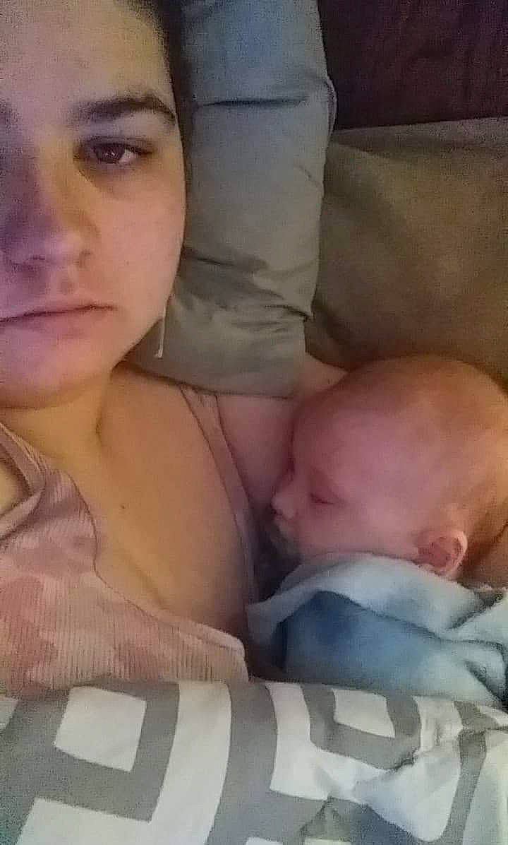 Dayton is registered to the contest to win money with this photo: baby, baby_products, baby_toddler_clothing, cheek, child, chin, comfort, face, head, linens, lip, living_room, nose, person, skin, toddler