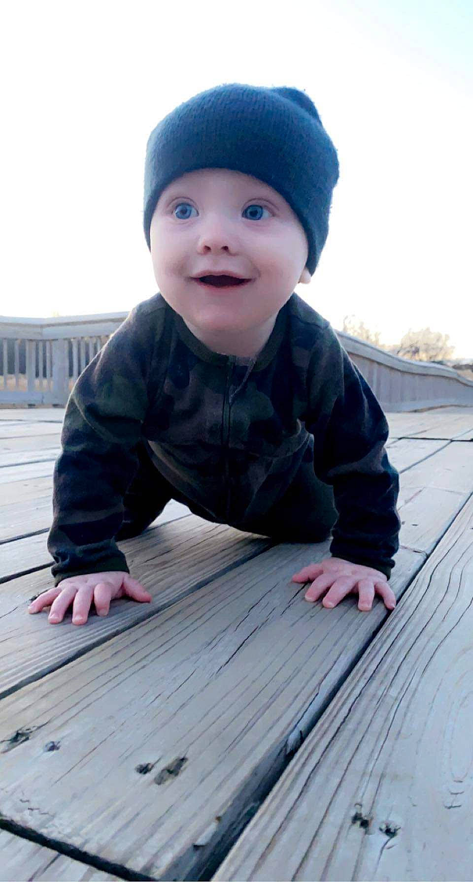Tommy joined the competition — help win amazing prizes! baby, baby_toddler_clothing, cap, composite_material, eye, face, flash_photography, flooring, happy, hardwood, headwear, joy, outerwear, people, person, product, skin, sky, sleeve, smile