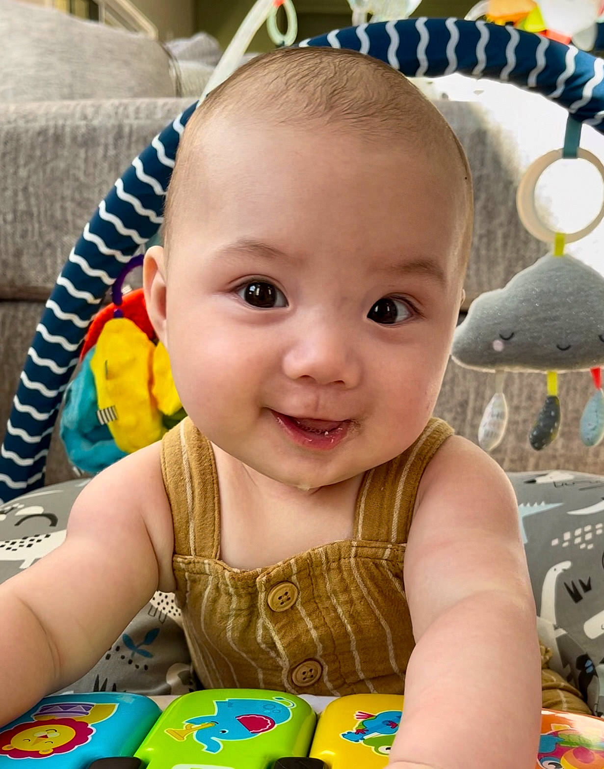 Elliott is registered to the contest to win money with this photo: baby, baby_playing_with_toys, baby_toddler_clothing, cheek, child, chin, ear, facial_expression, fun, green, hairstyle, happy, head, iris, joy, nose, person, photograph, product, skin