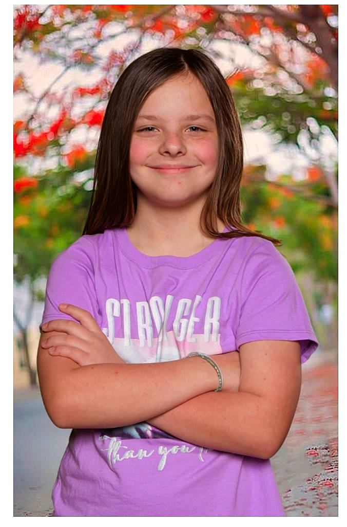 Lea is registered to the contest to win money with this photo: brown_hair, child, facial_expression, grass, happy, iris, joy, long_hair, magenta, peach, people_in_nature, person, pink, plant, portrait, portrait_photography, purple, sleeve, smile, spring