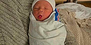 Afinna is registered to the contest to win money with this photo: architecture, baby, bed, bedroom, blanket, building, clothing, couch, face, furniture, glove, head, hospital, indoors, newborn, person, photography, portrait, quilt, sleeping