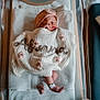 adult, architecture, baby, bed, blanket, bride, building, cradle, crib, face, female, furniture, head, hospital, infantbed, newborn, person, wedding, woman