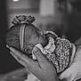 baby, bodypart, cap, childbirth, clothing, face, finger, hand, hat, head, newborn, person, photography, portrait, sleeping, wristwatch