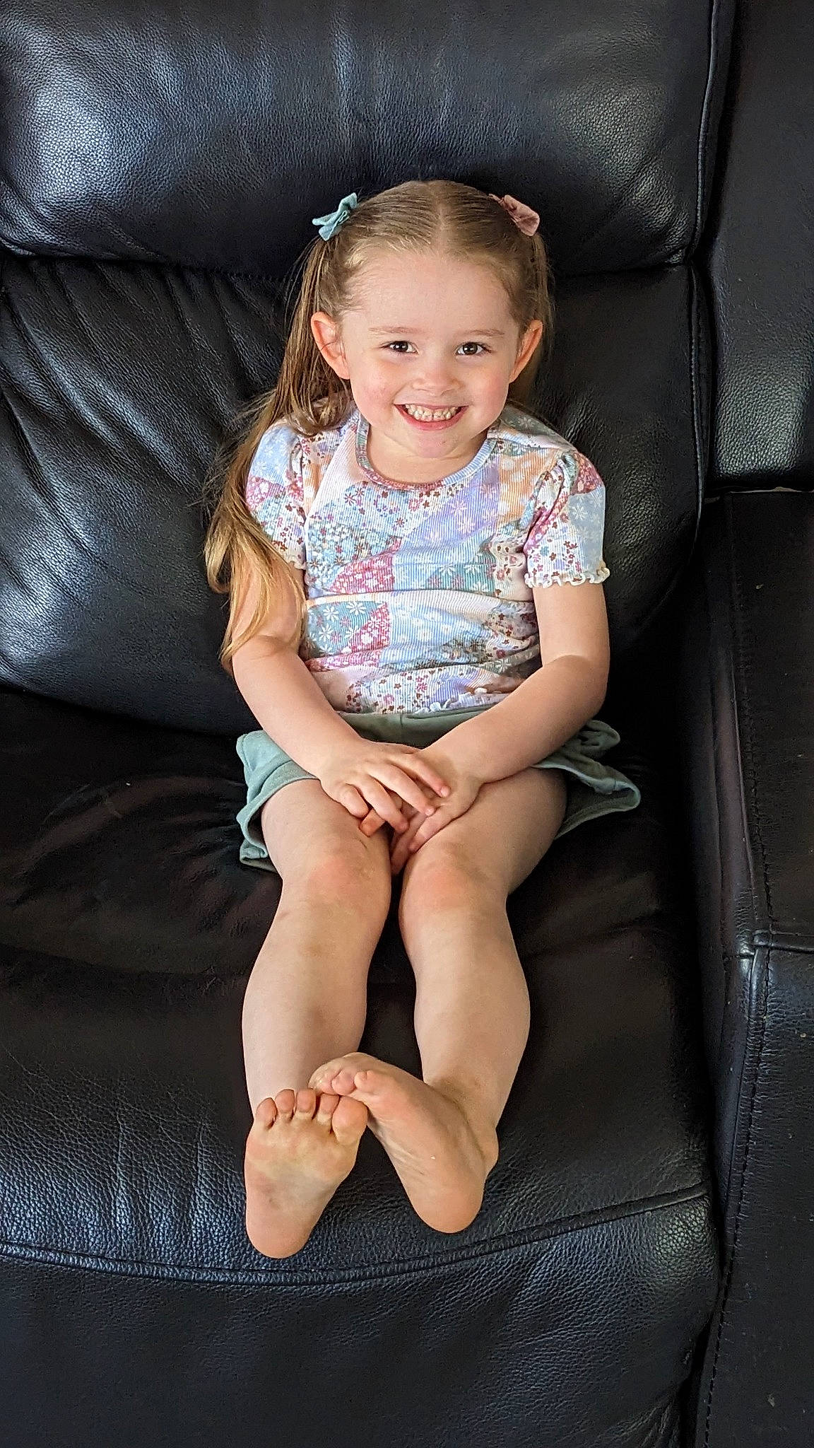 Emma joined the competition — help win amazing prizes! arm, baby_toddler_clothing, child, comfort, dress, eye, face, facial_expression, flash_photography, hairstyle, head, human_body, human_leg, joy, knee, lap, person, shorts, skin, smile