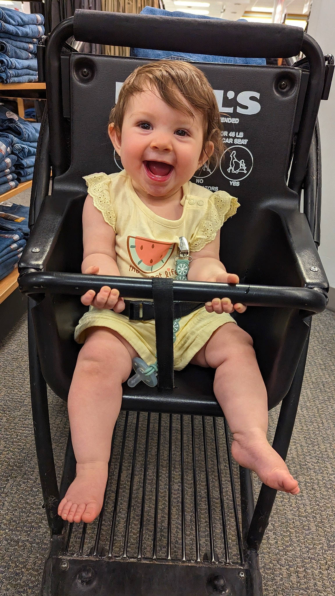 Annie is registered to the contest to win money with this photo: baby_toddler_clothing, beauty, black, blond, chair, child, comfort, foot, fun, happy, human_leg, joy, knee, lap, leisure, person, photograph, product, sitting, smile