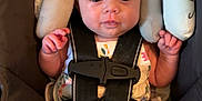 Harliegh is registered to the contest to win money with this photo: baby, bow, car_seat, child, clothing, cute, expression, face, floral, foot, hand, headband, indoors, infant, newborn, portrait, safety, seatbelt, sitting, straps