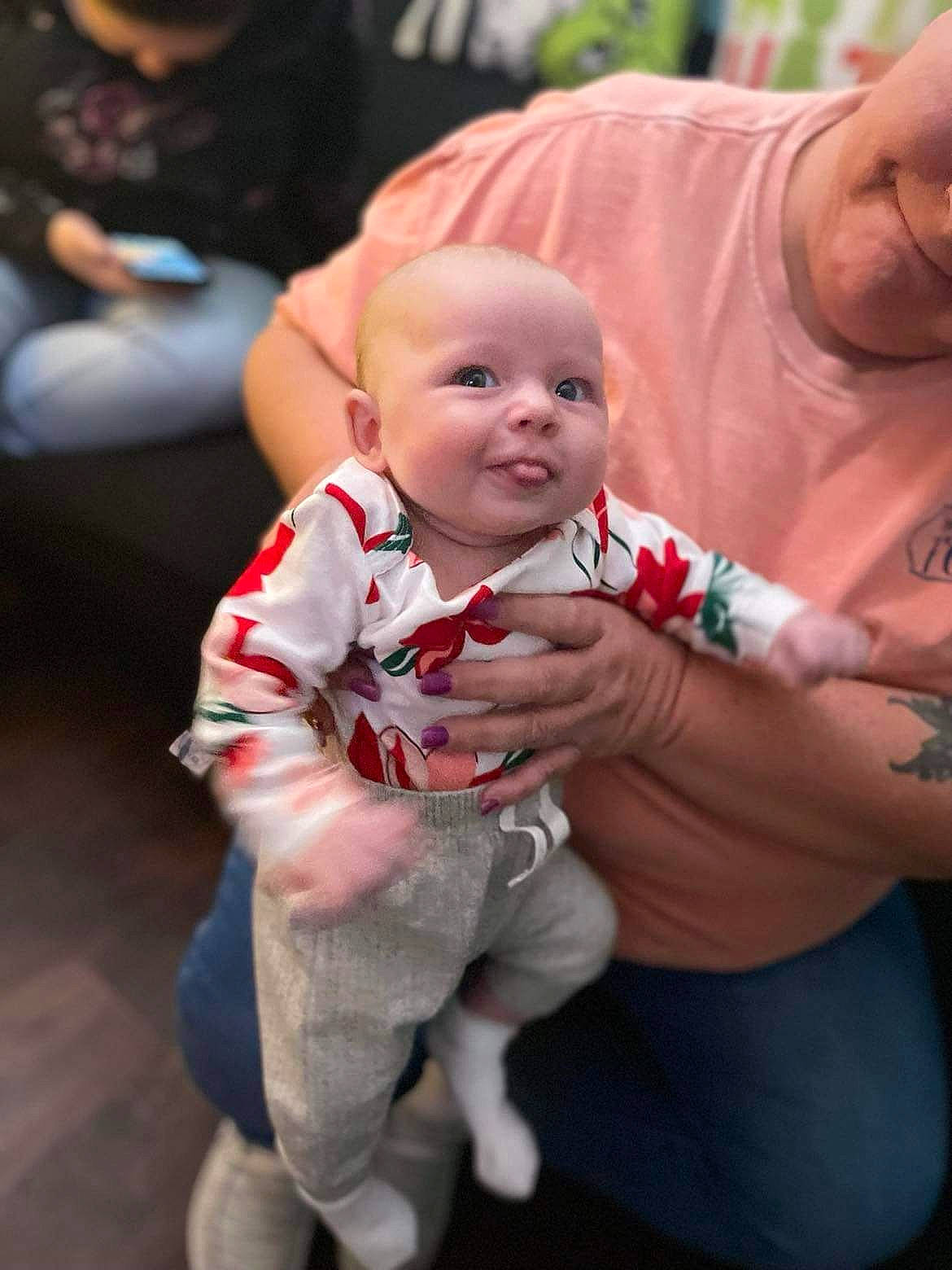 Caroline is registered to the contest to win money with this photo: baby, baby_toddler_clothing, cheek, child, event, eye, family, fictional_character, fun, fur, happy, leisure, person, pink, portrait_photography, recreation, sitting, skin, smile, t_shirt