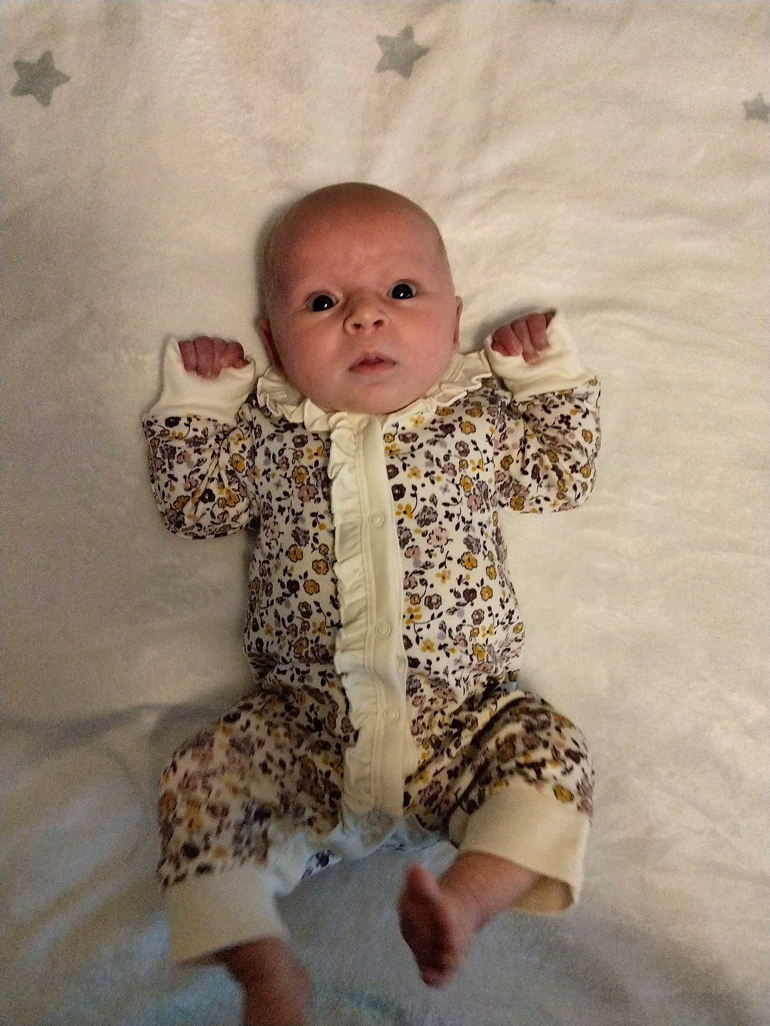 Caroline joined the competition — help win amazing prizes! baby, baby_toddler_clothing, cheek, child, collar, comfort, day_dress, eye, flooring, foot, fur, human_leg, iris, pattern, person, sitting, skin, sleeve, toddler, wood