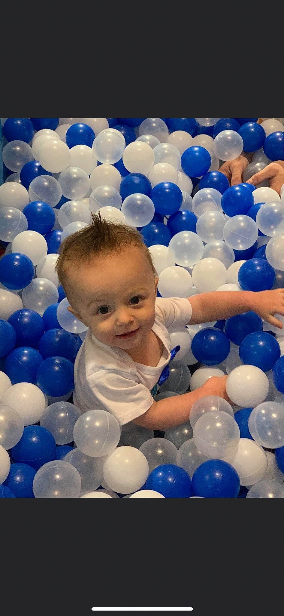 Memphis Todd Stone is registered to the contest to win money with this photo: azure, balloon, blue, clothing, daytime, fun, happy, human, leisure, light, natural_environment, organ, party_supply, person, photograph, product, smile, toddler, toy, white