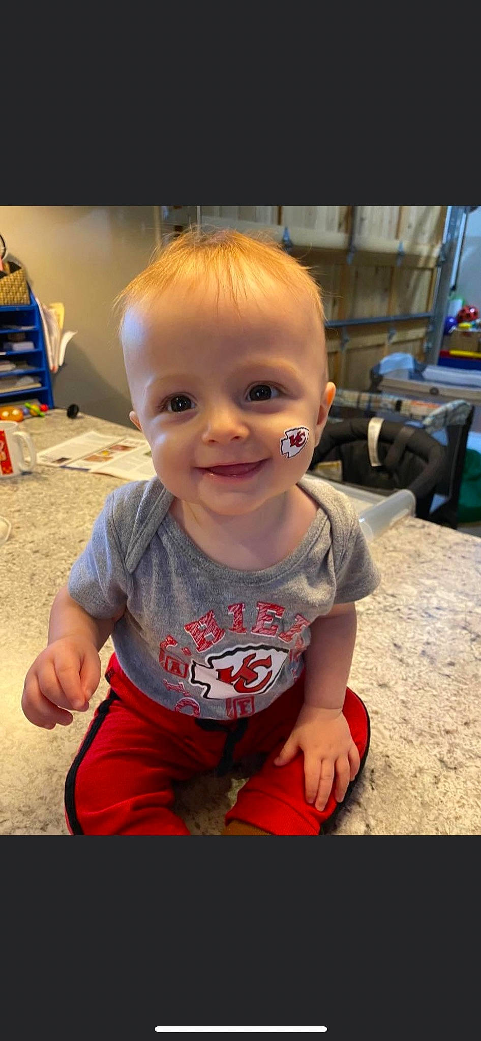 Memphis Todd Stone is registered to the contest to win money with this photo: baby, baby_toddler_clothing, cheek, chin, clothing, eye, flooring, fun, happy, iris, joy, leg, mouth, nose, person, skin, sleeve, smile, standing, t_shirt