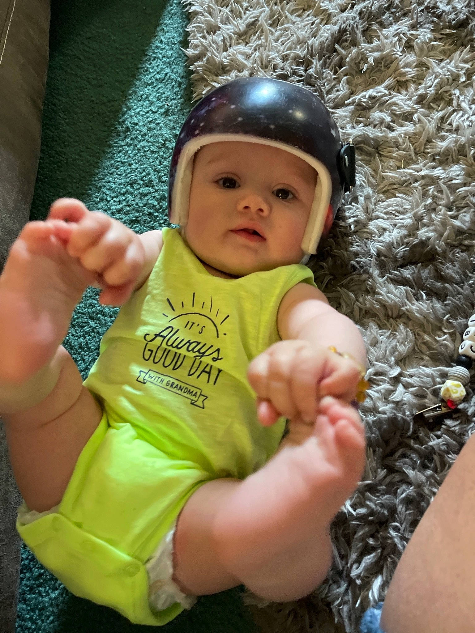 Marcellus is registered to the contest to win money with this photo: arm, baby, baby_toddler_clothing, cap, cheek, child, cool, eye, finger, fun, gesture, hand, happy, headwear, nail, people_in_nature, person, personal_protective_equipment, pink, sleeve
