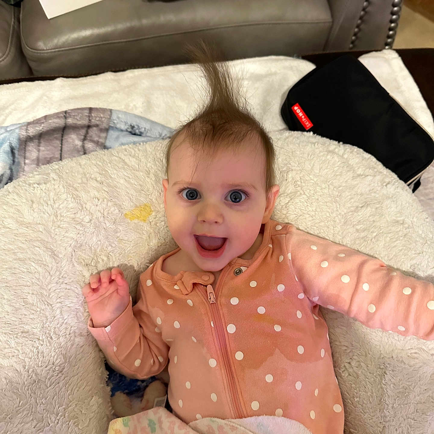 Laken joined the competition — help win amazing prizes! baby, babylaughing, blanket, clothing, couch, cushion, face, furniture, hair, happy, head, homedecor, person, photography, portrait, sitting, sleeve, smile