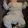 baby, sleeping, sweatshirt, sweatpants, under_armour, socks, couch, indoor, child, relaxing, cozy, infant, clothing, person, rest, casual, soft, comfort, young_child, peaceful