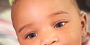 Beyon joined the competition — help win amazing prizes! baby, close_up, face, smile, child, infant, cute, young, portrait, eyes, apparel, bib, hair_bow, skin, cheeks, mouth, expression, adorable, person, indoors