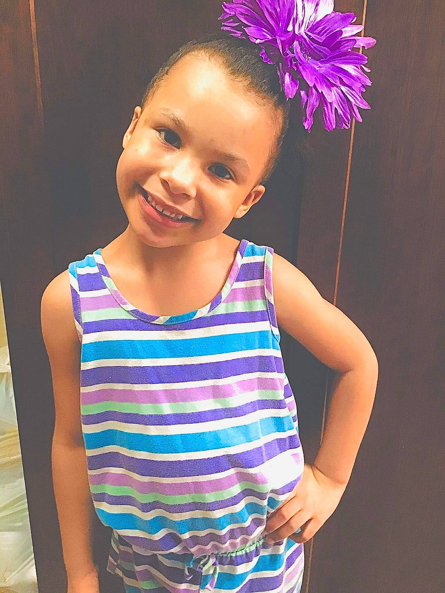 Noella is registered to the contest to win money with this photo: child, child_model, hair_accessory, joy, person, pink, purple, smile, toddler