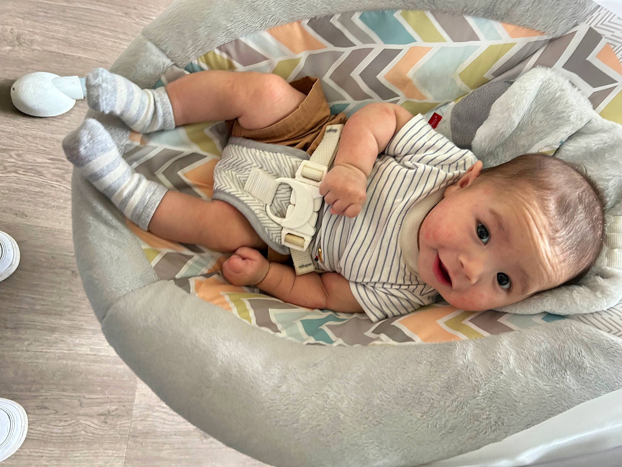Bellamy is registered to the contest to win money with this photo: baby, baby_products, baby_safety, baby_sleeping, baby_toddler_clothing, child, comfort, flooring, foot, human_leg, lap, leisure, linens, pattern, person, room, sitting, textile, thigh, toddler