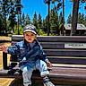 Aadvik joined the competition — help win amazing prizes! bench, cap, casual_clothing, child, curious, daylight, denim_jacket, greenery, jeans, nature, outdoor, park, person, portrait, sky, sneakers, sunny, toddler, trees, wooden_bench