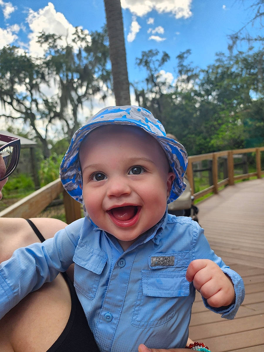 Elijah is registered to the contest to win money with this photo: azure, baseball_cap, cap, child, cloud, facial_expression, finger, fun, gesture, happy, hat, headwear, joy, leisure, person, recreation, skin, sky, smile, summer