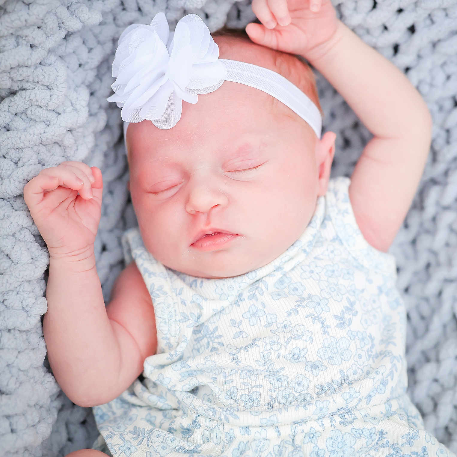 Delilah joined the competition — help win amazing prizes! arms, baby, blanket, blue_flower_pattern, child, closed_eyes, clothing, cute, face, flower, headband, infant, knit, newborn, peaceful, portrait, resting, skin, sleeping, soft