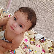 Rubi joined the competition — help win amazing prizes! baby, bare_skin, candid, child, colorful, curious, cute, floor_mat, home, indoor, infant, looking_up, mat, mesh_netting, playpen, portrait, sitting, soft_lighting, teddy_bear_pattern, young_child