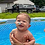 baby, child, pool, water, smile, happy, outdoor, grass, house, truck, person, hand, summer, fun, play, tattoo, blue, skin, expression, nature