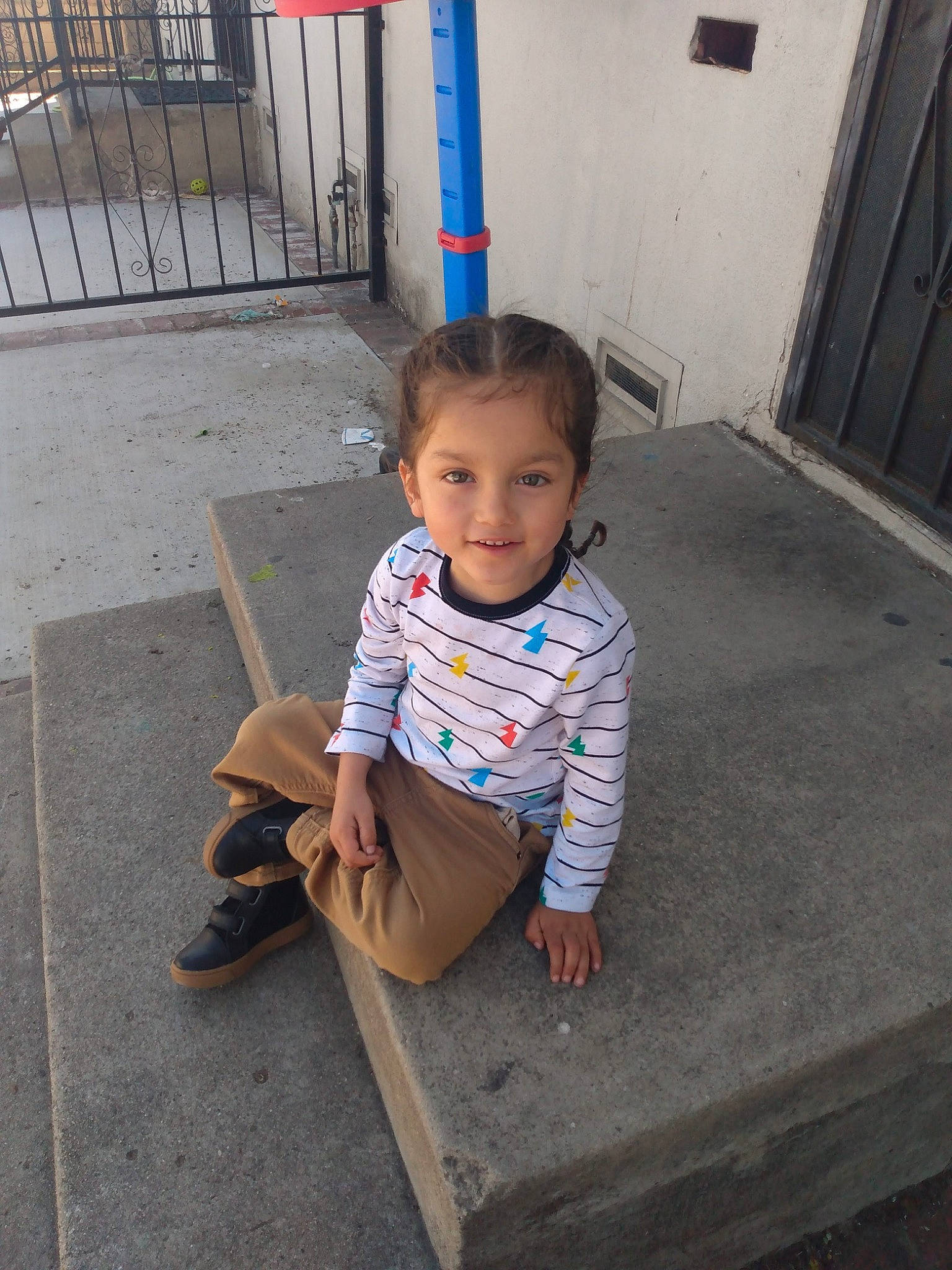 Tomas joined the competition — help win amazing prizes! baby_toddler_clothing, concrete, door, eye, face, floor, flooring, grass, hair, hairstyle, joy, leg, leisure, mammal, person, road_surface, sidewalk, sleeve, standing, t_shirt