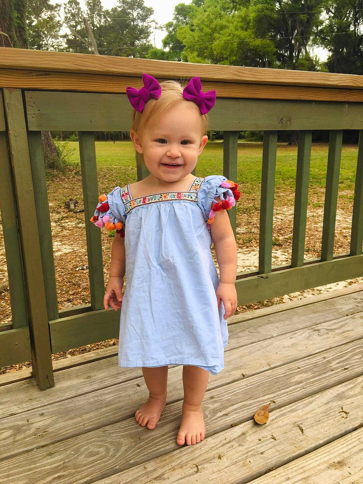 Marianna is registered to the contest to win money with this photo: baby_toddler_clothing, child, clothing, day_dress, dress, fun, grass, happy, head, joy, leisure, person, pink, plant, sleeve, smile, standing, summer, toddler, tree