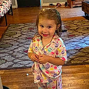 Sophia joined the competition — help win amazing prizes! area_rug, cabinet, child, colorful_clothing, door, furniture, girl, happy, home, indoors, living_room, pajamas, photography, playful, portrait, shoes, smiling, standing, toddler, wood_floor