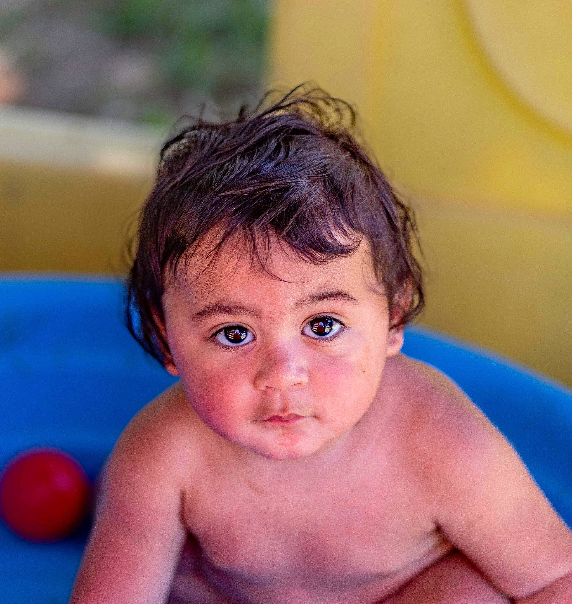 Donald is registered to the contest to win money with this photo: arm, azure, baby, baby_bathing, ball, bathing, cheek, chest, child, eye, eyelash, fun, happy, human_body, iris, leisure, muscle, nose, person, skin