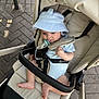 Romeo joined the competition — help win amazing prizes! baby, bucket_hat, pacifier, stroller, child, outdoor, pavement, safety_strap, beads, curious, infant, footwearless, sunlight, cushion, seat, person, cute, comfort, light, hat