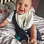 Xander-Richie is registered to the contest to win money with this photo: baby, babylaughing, bed, bedroom, clothing, couch, cushion, face, furniture, happy, head, homedecor, indoors, jeans, pants, person, photography, portrait, room, smile