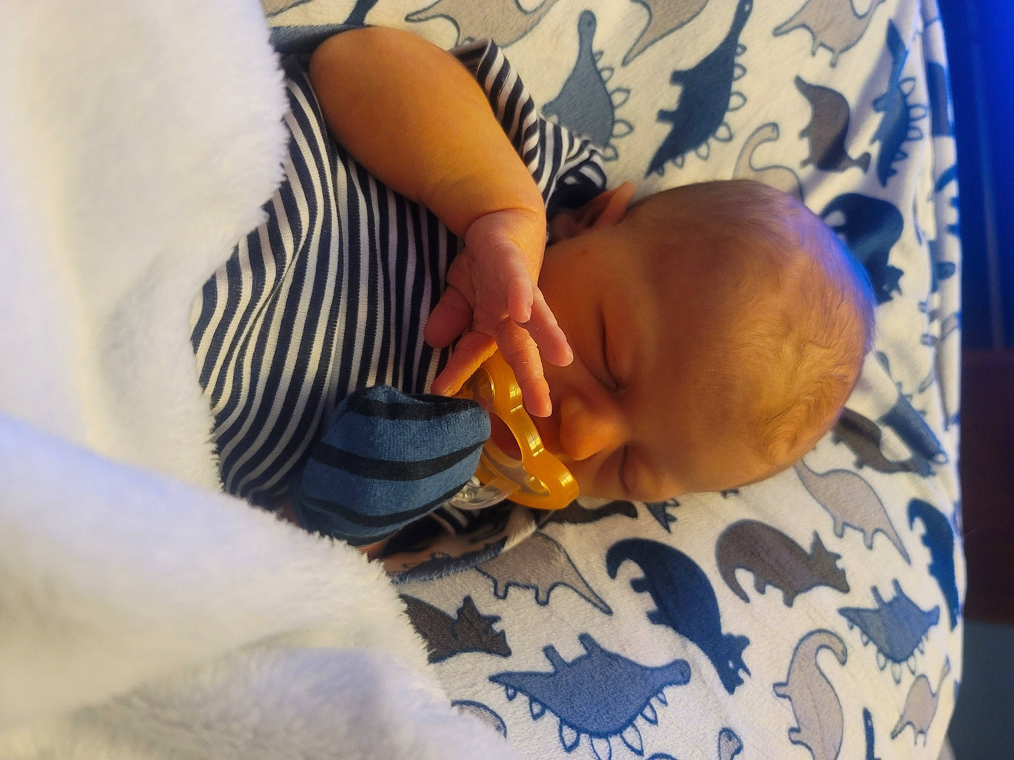 Wyatt is registered to the contest to win money with this photo: abdomen, baby, baby_products, baby_sleeping, bedtime, child, comfort, elbow, finger, human_body, human_leg, knee, leg, linens, nail, person, thumb, toddler, trunk, wood