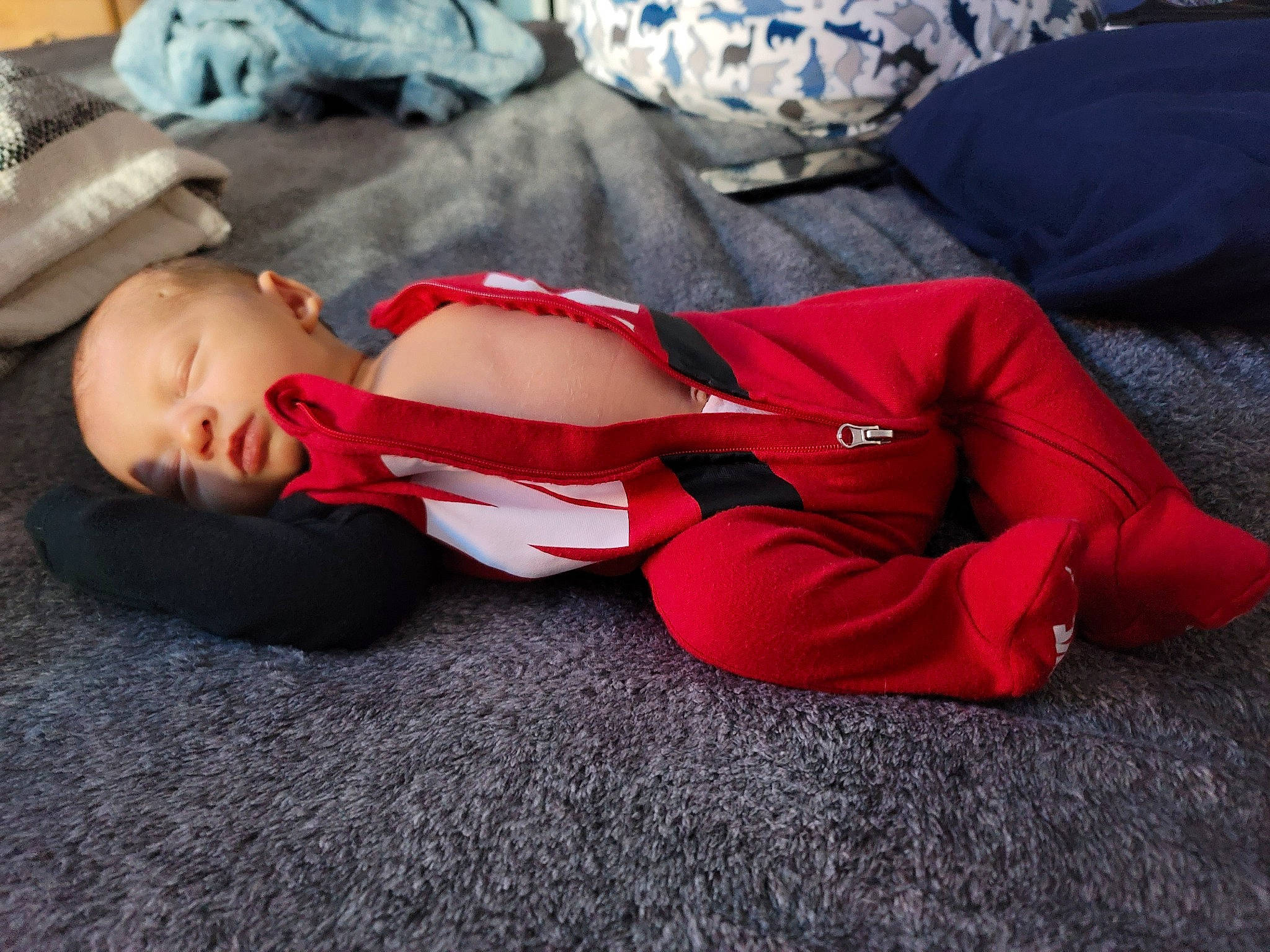 Wyatt joined the competition — help win amazing prizes! baby, baby_sleeping, baby_toddler_clothing, carmine, child, comfort, elbow, flooring, human_body, human_leg, knee, leg, linens, nap, person, sitting, sleep, sleeve, thigh, toddler