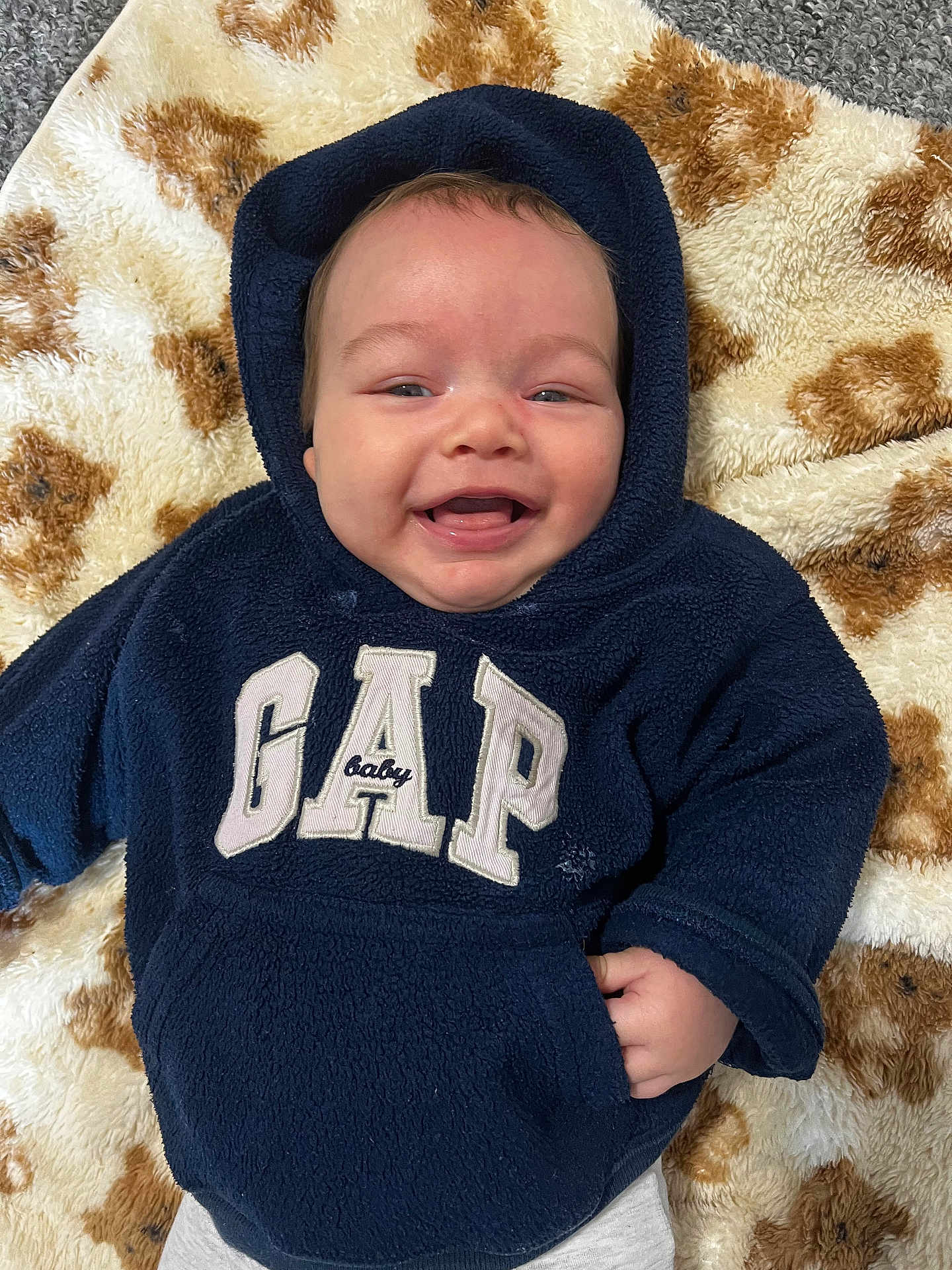 Kalvin-Ellis is registered to the contest to win money with this photo: baby, babylaughing, clothing, coat, crying, face, happy, hat, head, hood, hoodie, jacket, knitwear, person, photography, portrait, sad, smile, sweater, sweatshirt