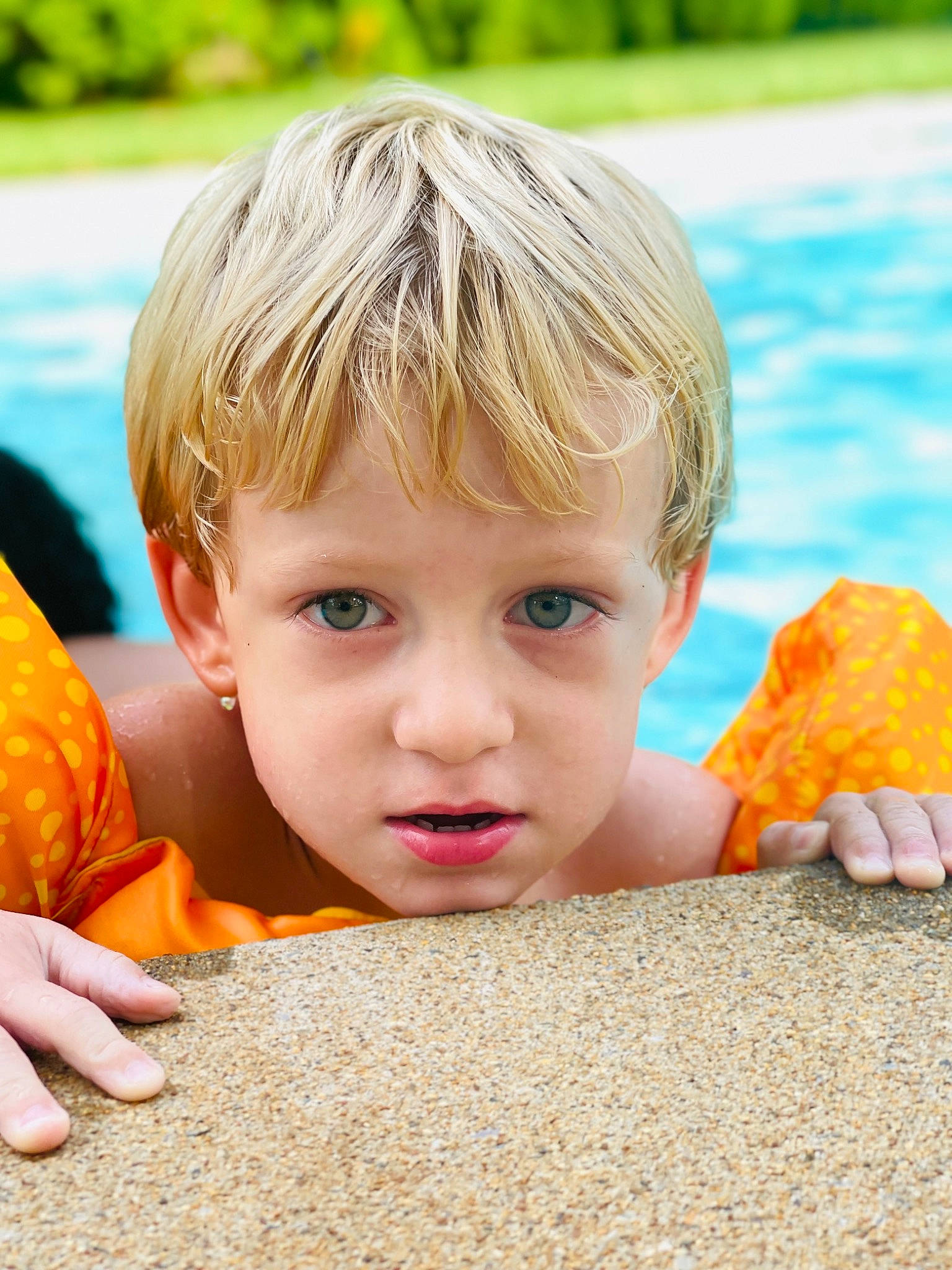 Emrie joined the competition — help win amazing prizes! bangs, blond, child, close_up, eye, facial_expression, finger, fun, grass, hair, hairstyle, happy, head, leisure, people_in_nature, person, play, skin, surfer_hair, toddler
