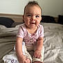 baby, child, infant, sitting, bed, blanket, clothing, foot, hand, happy, cute, indoors, person, portrait, skin, smile, soft, toddler, toy, white