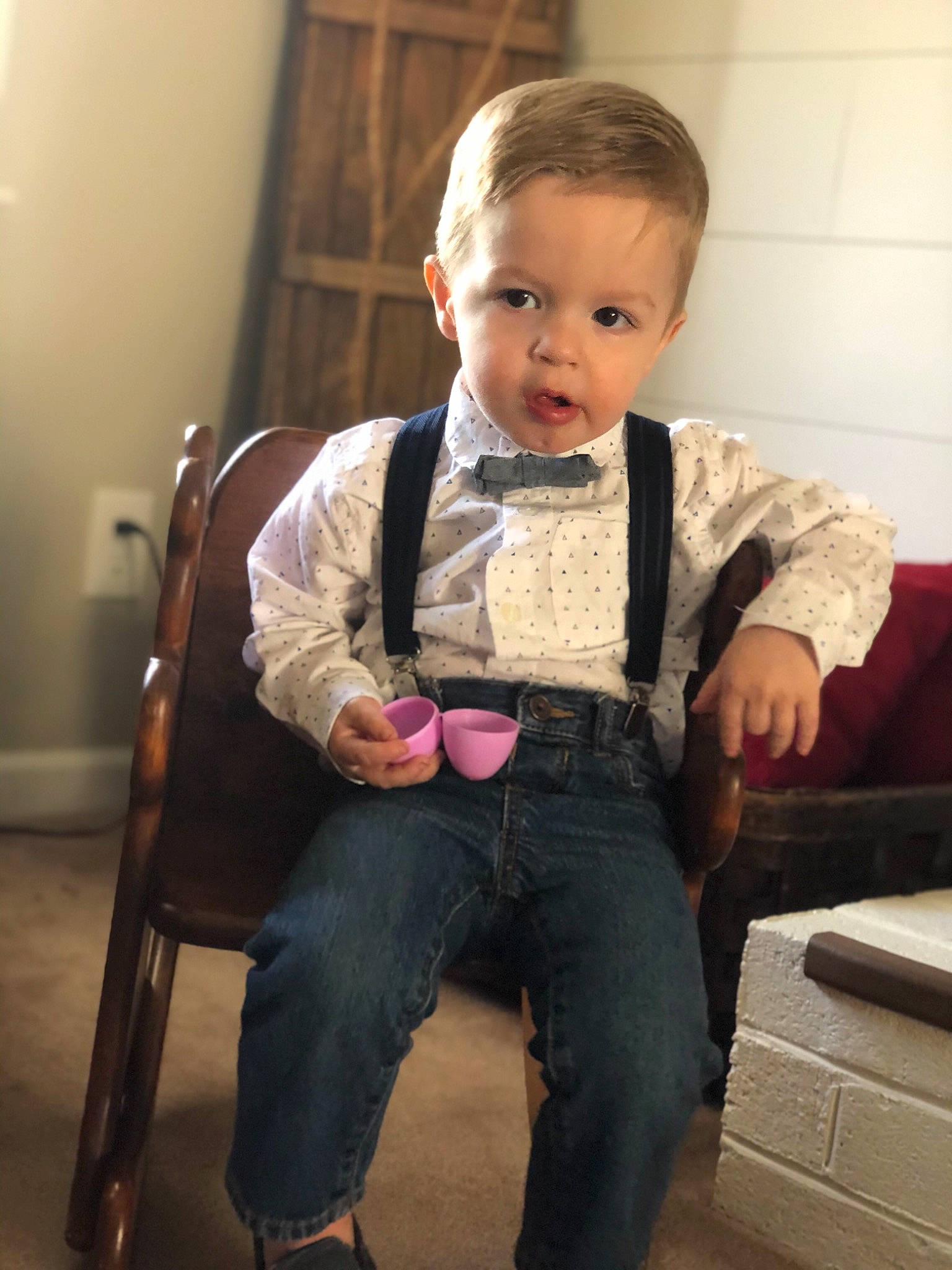 Oliver is registered to the contest to win money with this photo: baby, cheek, child, jeans, outerwear, person, sitting, sleeve, smile, standing, suspenders, toddler