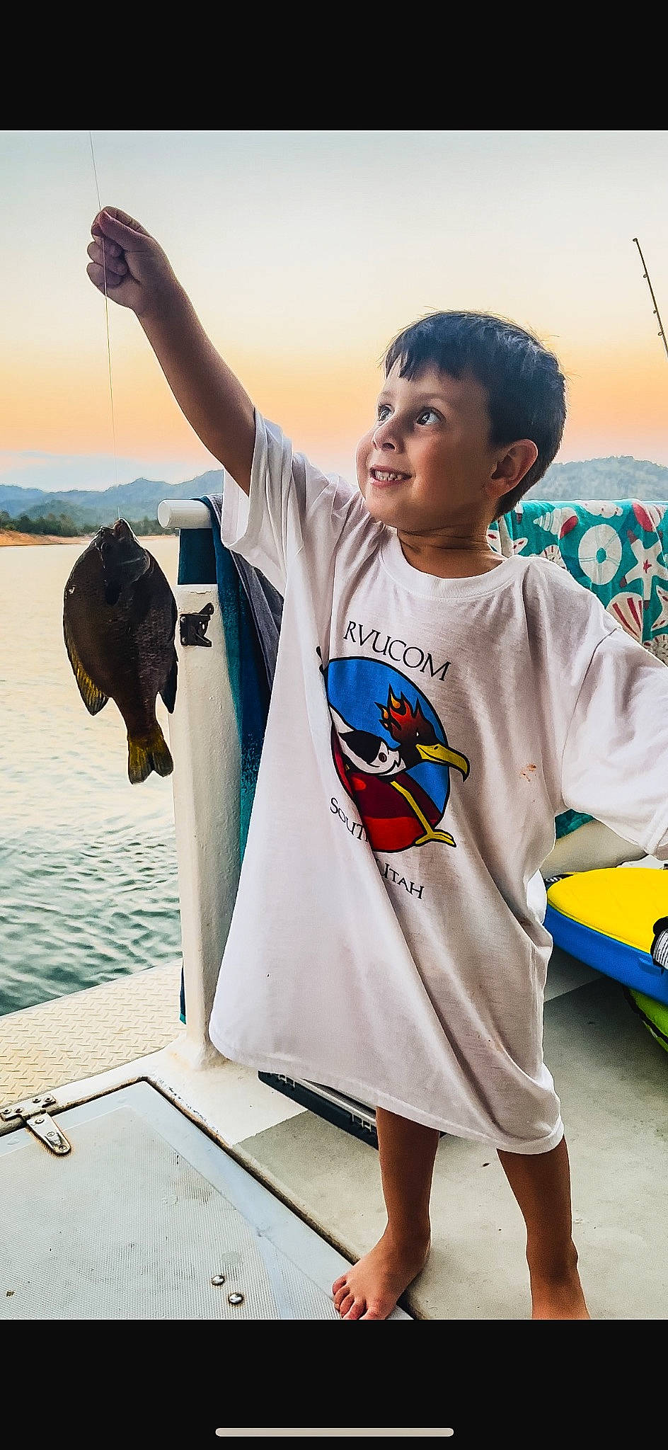 Jack is registered to the contest to win money with this photo: body_of_water, cool, fun, gesture, happy, human, joy, landscape, leisure, person, photograph, recreation, shorts, sleeve, smile, snapshot, summer, t_shirt, toddler, travel